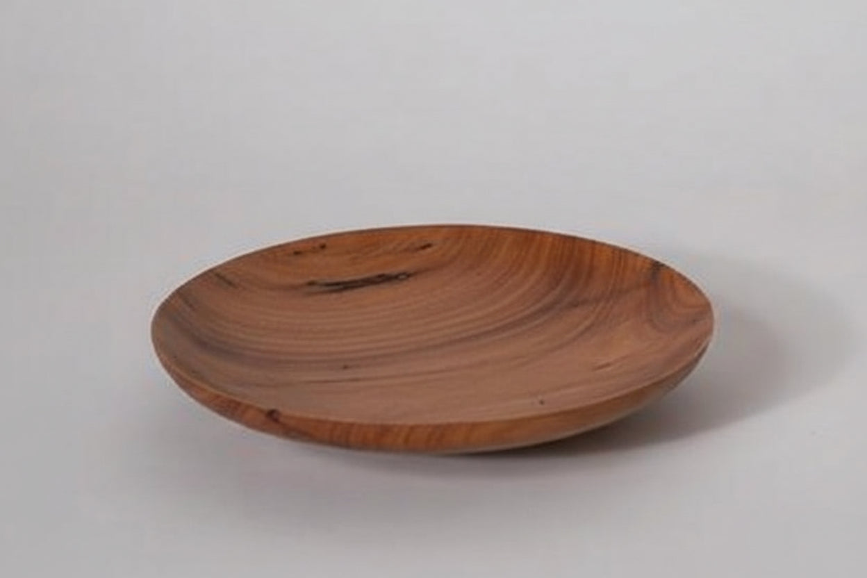 Wooden plate on a white background