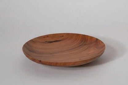 Wooden plate on a white background