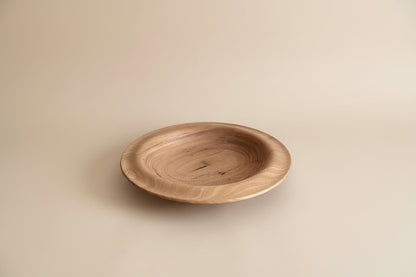 Wooden plate on a light gray background