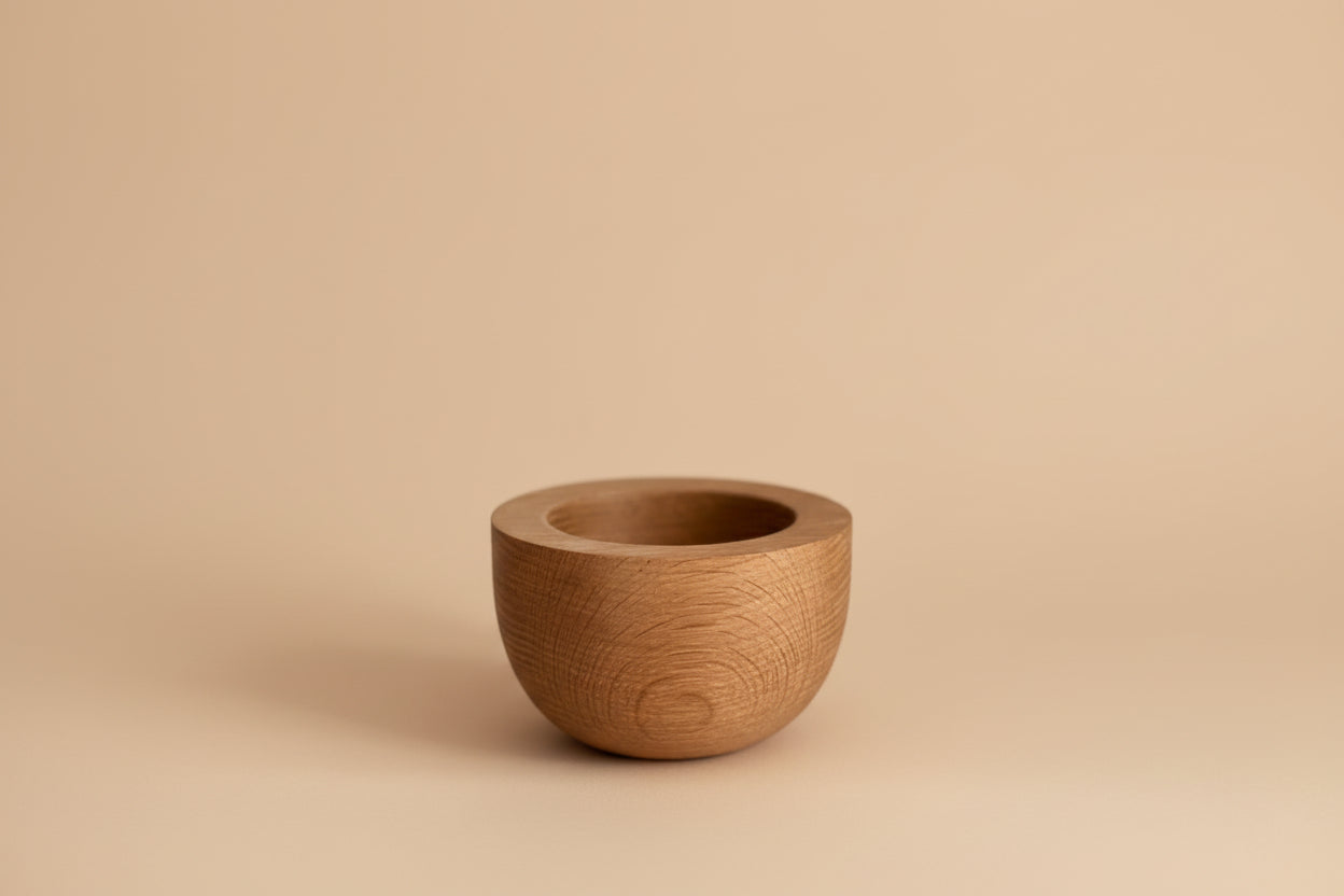 Wooden bowl on a plain background