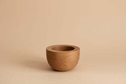 Wooden bowl on a plain background