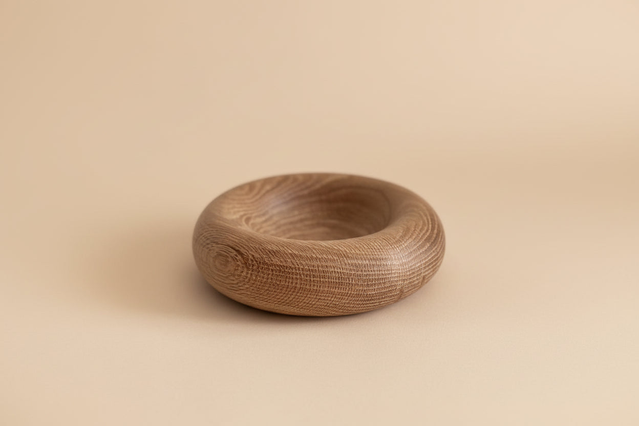 Wooden bowl on a light gray background