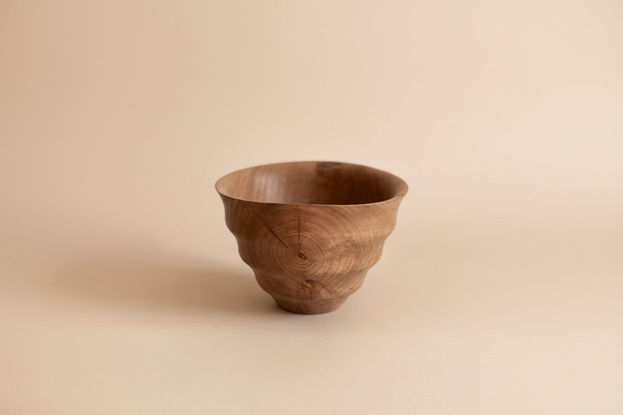 Wooden bowl on a light gray background