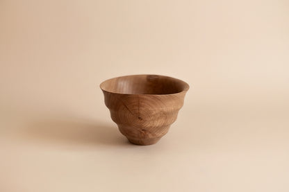 Wooden bowl on a light gray background