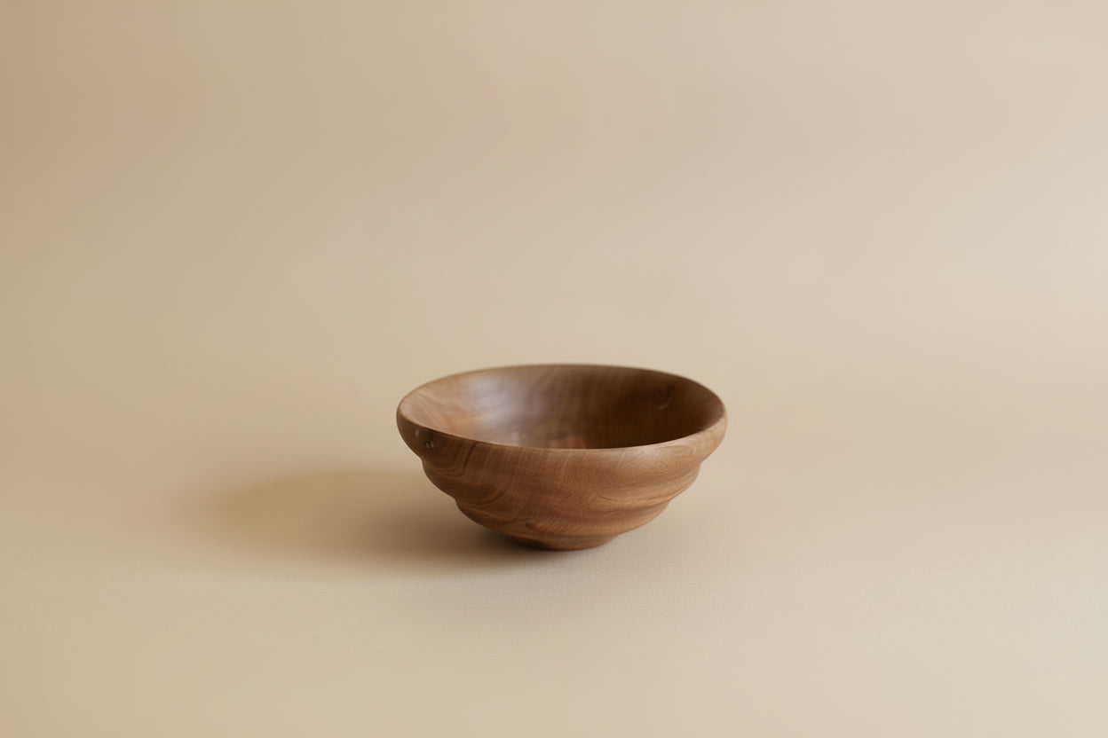 Wooden bowl on a light gray background